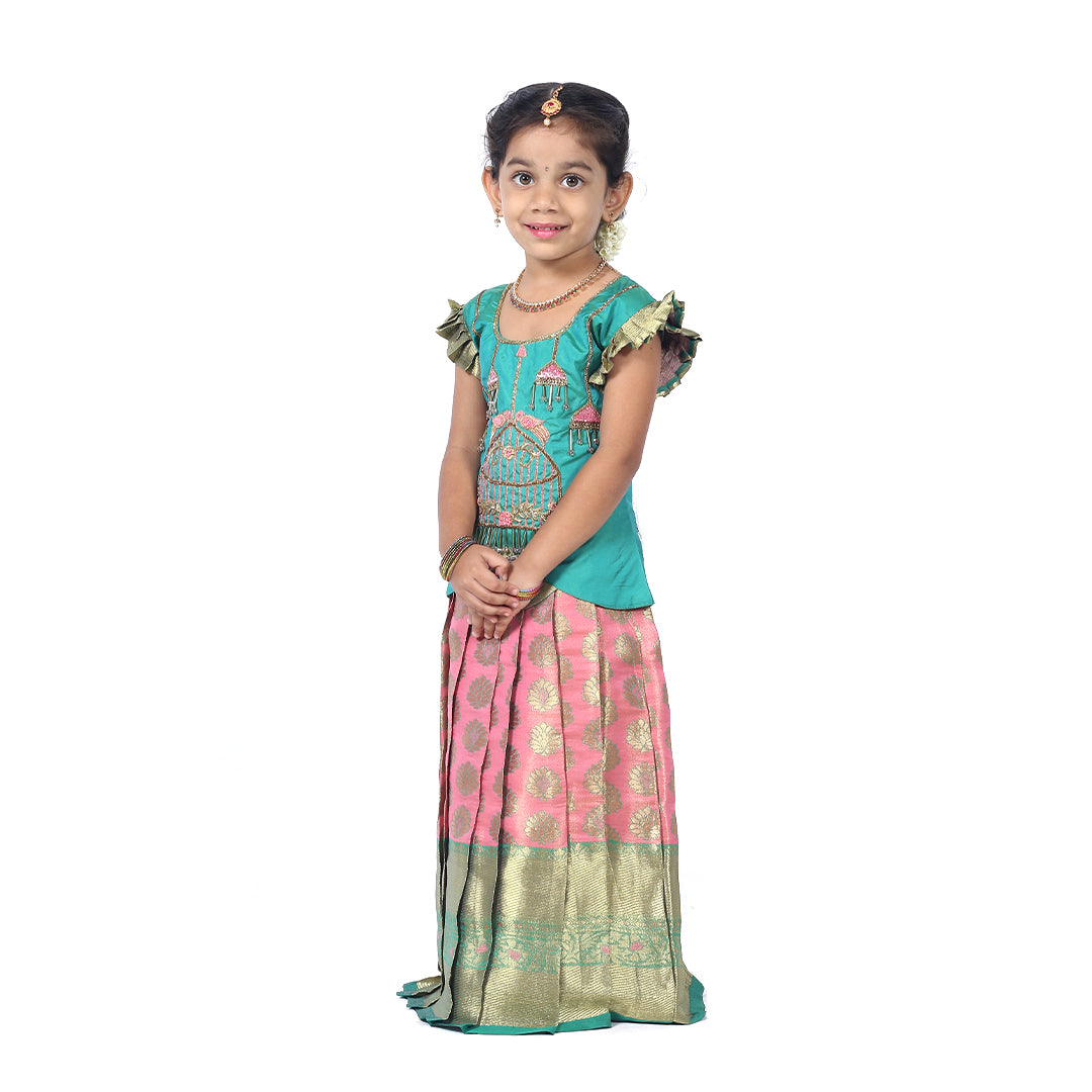 Green Pattupavadai set with pastel pink pleated skirt with Cutshanas and embroidery